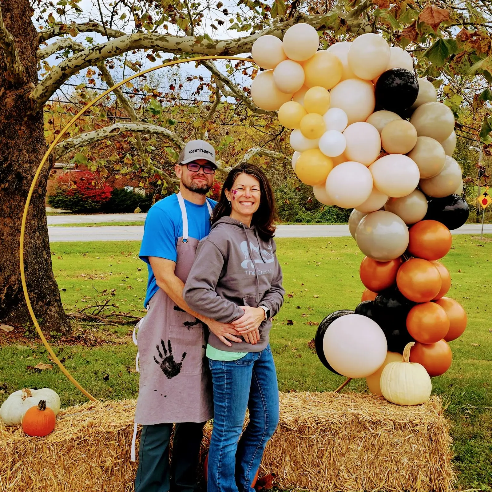 A couple outdoors in the fall