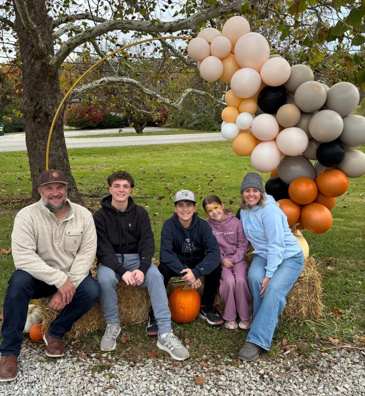 A family outdoors in the fall