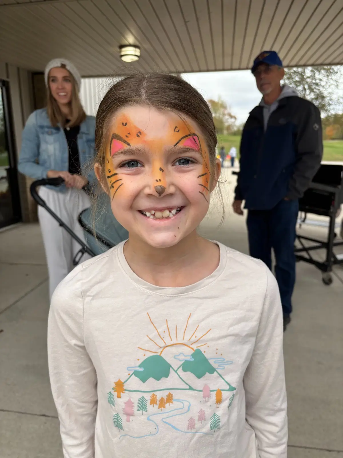 A child with tiger face paint
